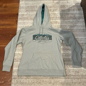 Woman’s Cabelas sweatshirt